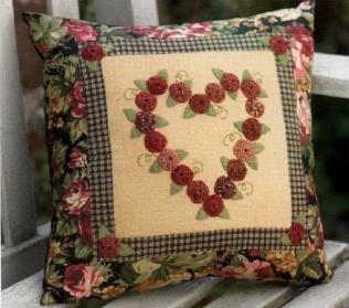 Cuscino cucito decorato con rose