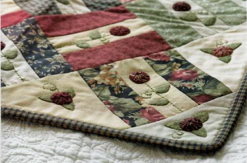 Come creare un quilt patchwork con rose yo-yo con il cucito