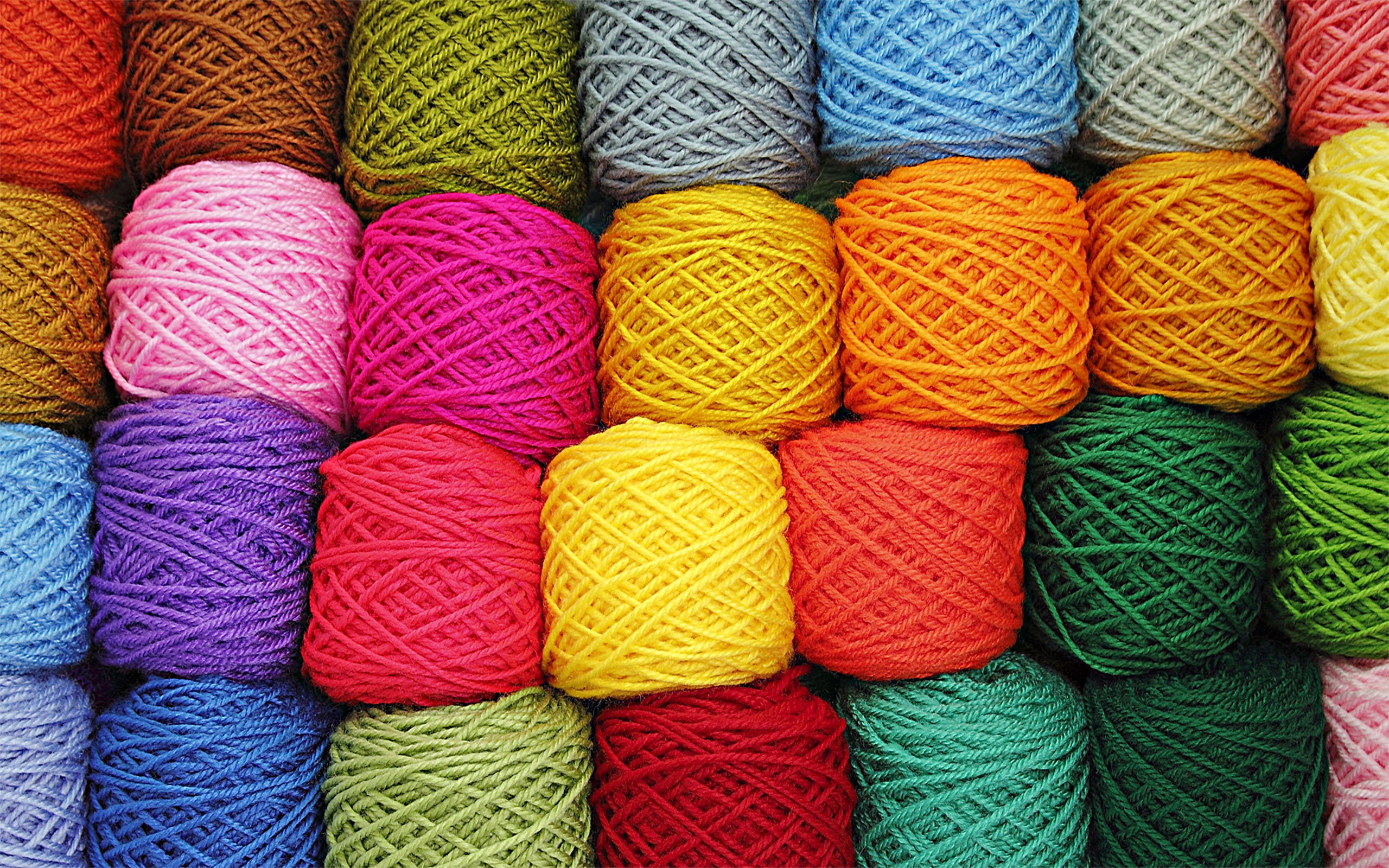 variety wool balls colored fiber texture background