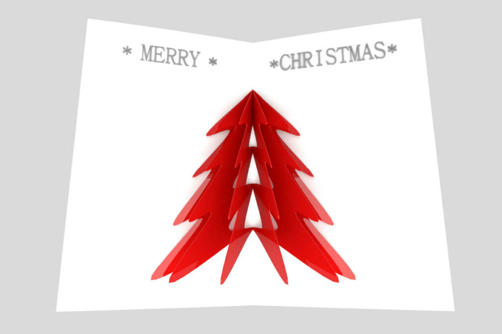 bigliettino con carta bianca, scritta in alto merry christmas, con albero di natale di colore rosso al centro