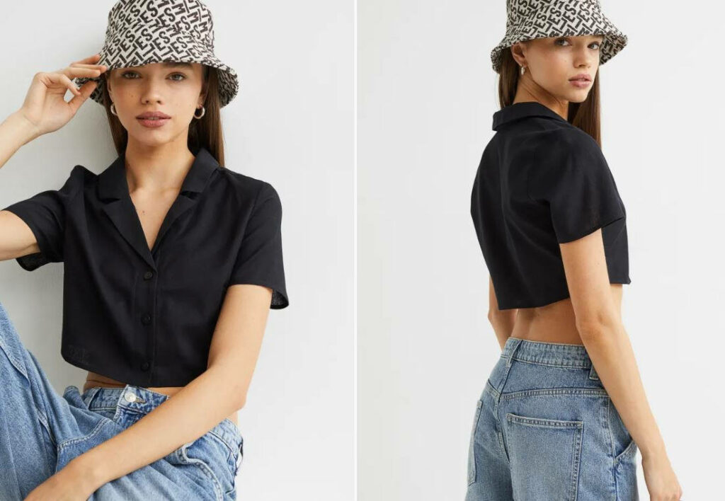 ragazza indossa camicia cropped di colore nero, cappellino bianco e nero e jeans chiari a vita bassa