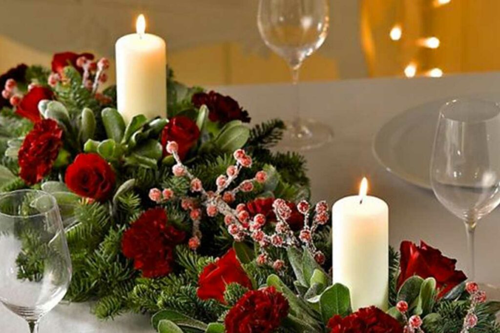 composizione floreale con rose e candele