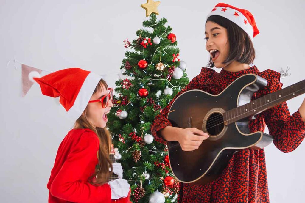 sorelle cantano e suonano canzoni di natale