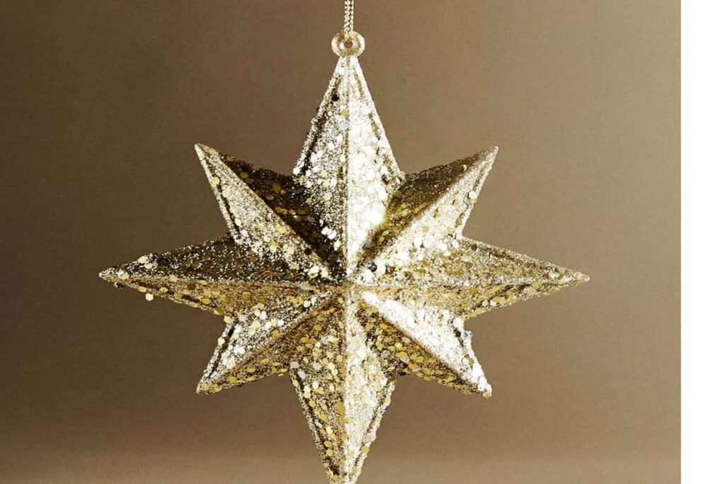 pallina natalizia per l'albero a forma di stella con glitter dorati