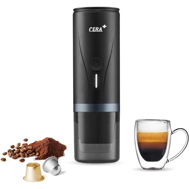 macchina da caffè nera cilidrica con grani di caffè, cialde e tazzina di caffè