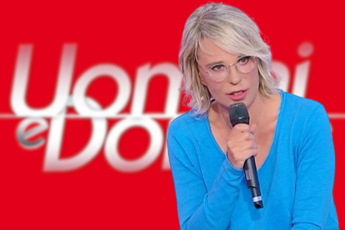 Maria De Filippi e logo Uomini e Donne