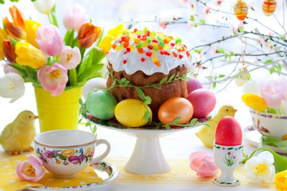 Easter cake and colourful eggs on festive Easter table
