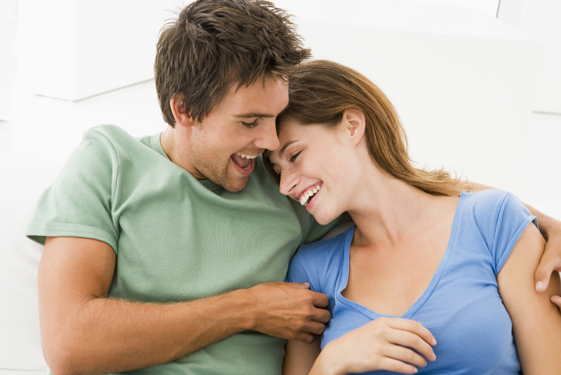 Couple in living room smiling