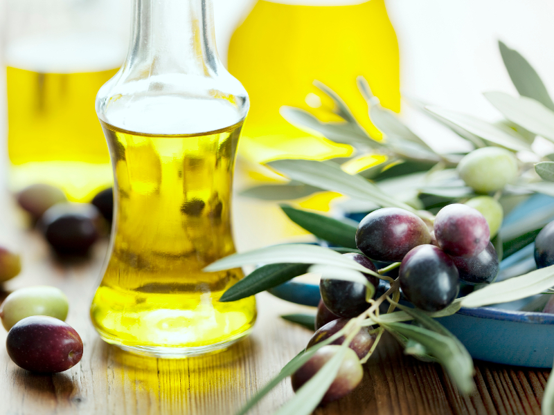 olive oil on wooden table