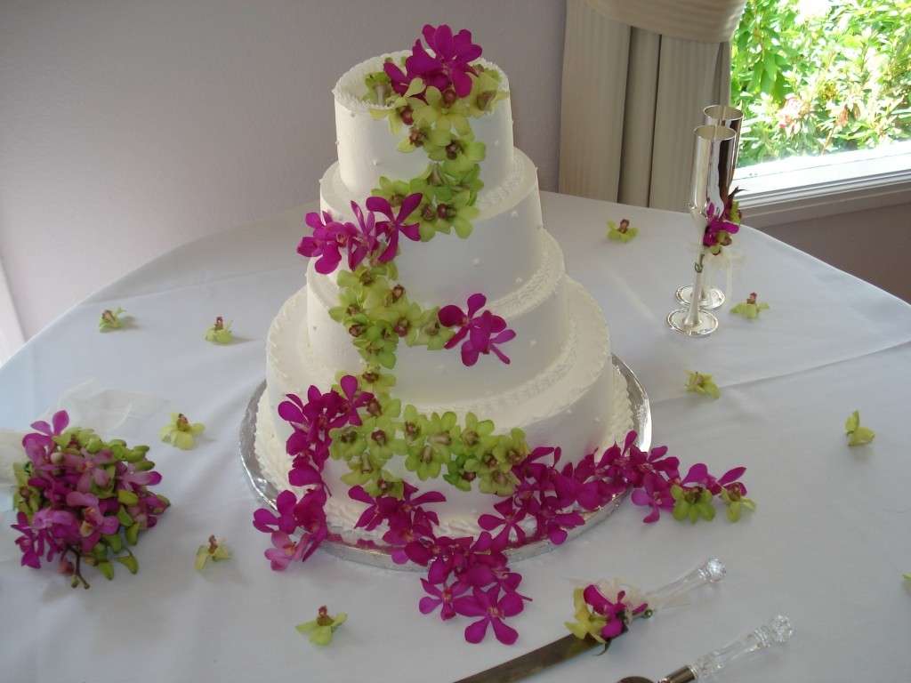 Torta nuziale fiori orchidee rosa e verdi