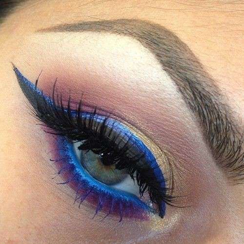 Occhi verdi con eyeliner blu e oro