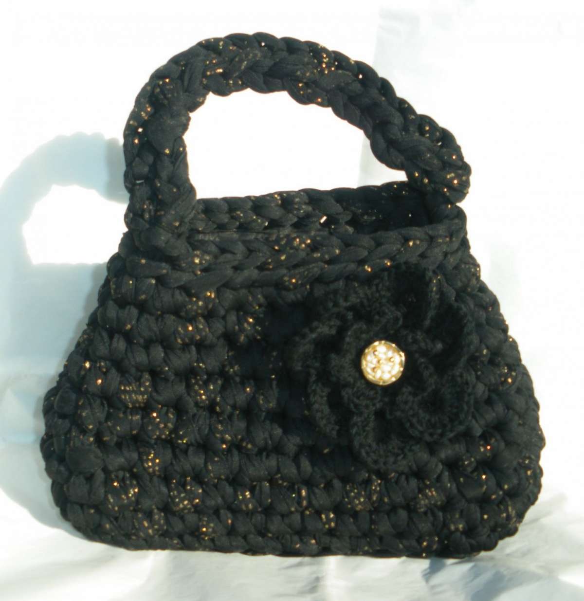 Borsa con fettuccia e fiore