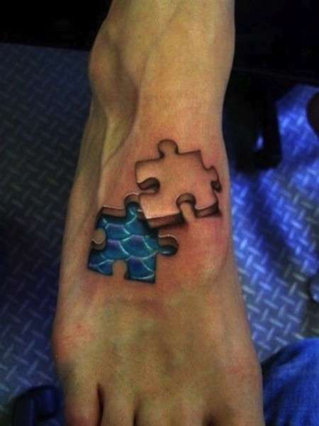 Pezzi di puzzle tatuaggio in 3D sul piede