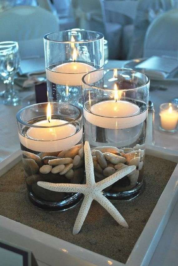 Centrotavola con candele e stelle marine