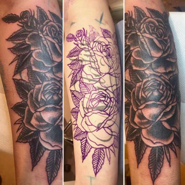 Cover up tattoo sul braccio con rose nere