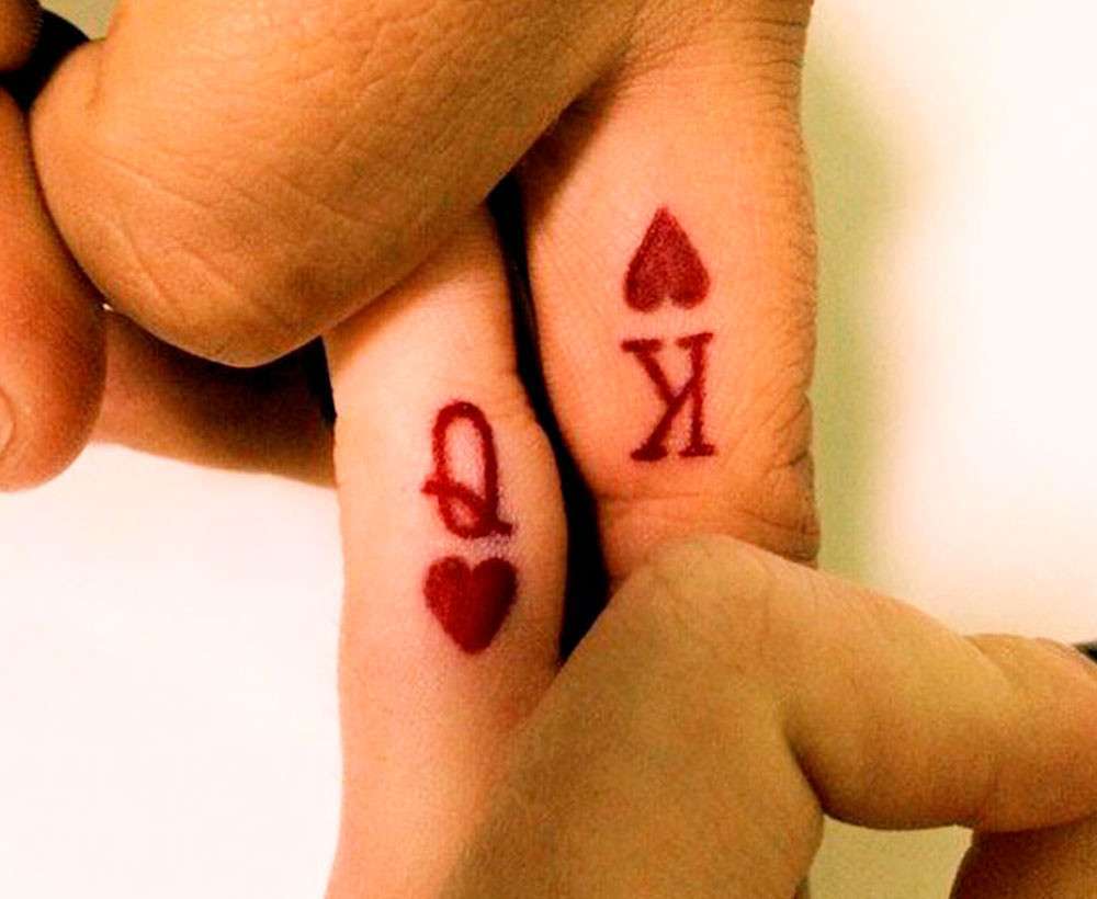 Tatuaggio di coppia con simboli delle carte